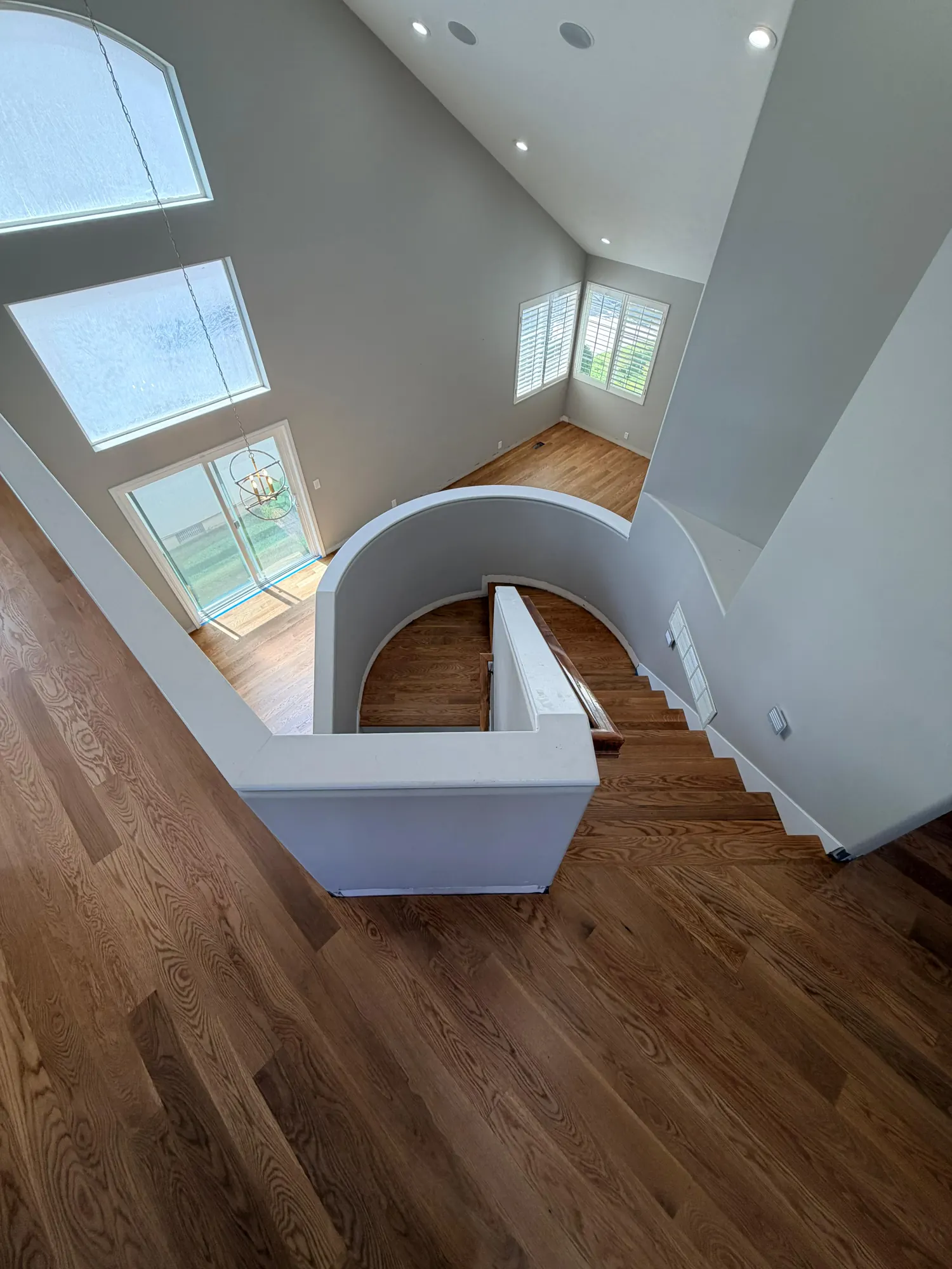 Real Plank & Go curved hardwood stairwell install in a Utah home
