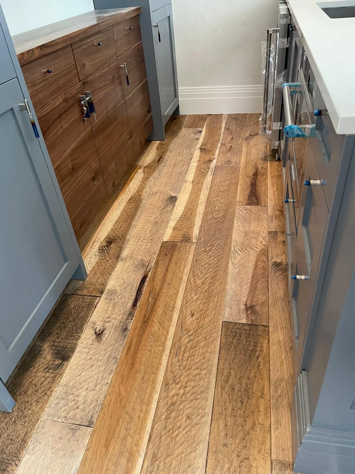 Real Plank & Go character-grade hardwood kitchen install in a Utah home