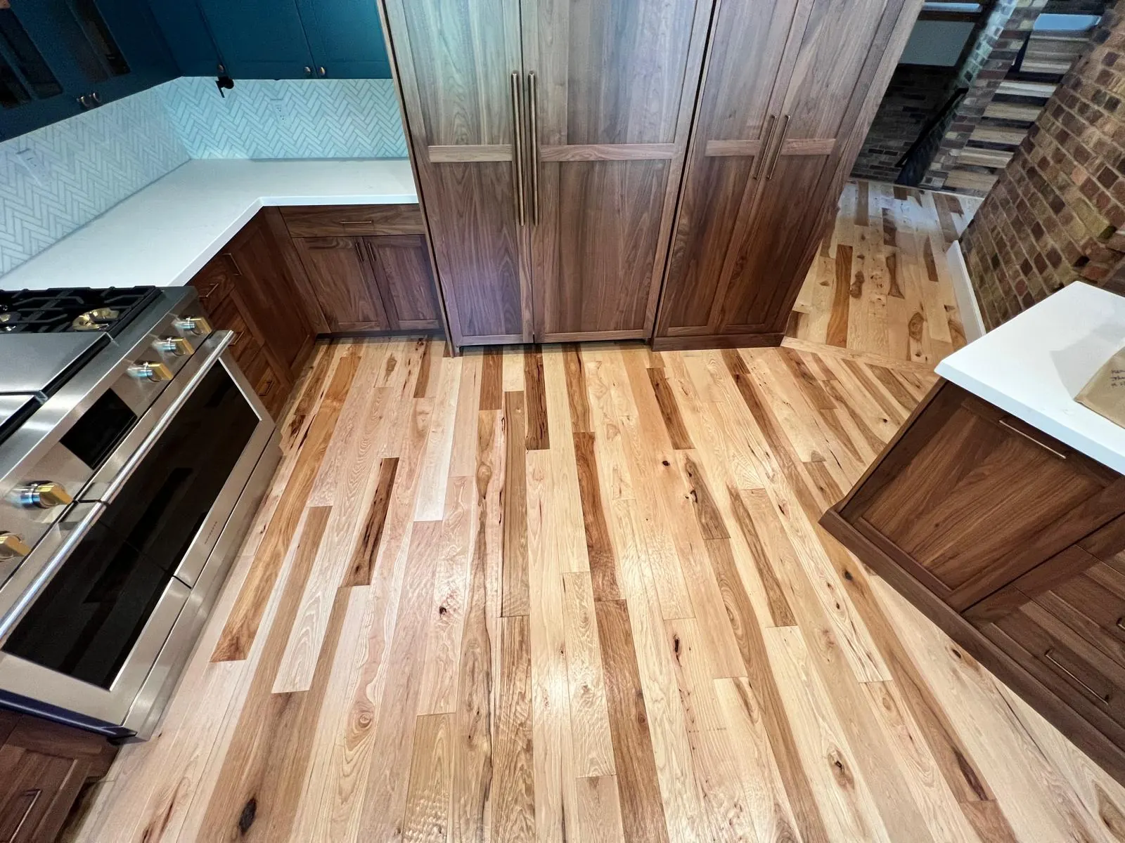 Real Plank & Go hardwood kitchen with dark cabinets in a Utah home
