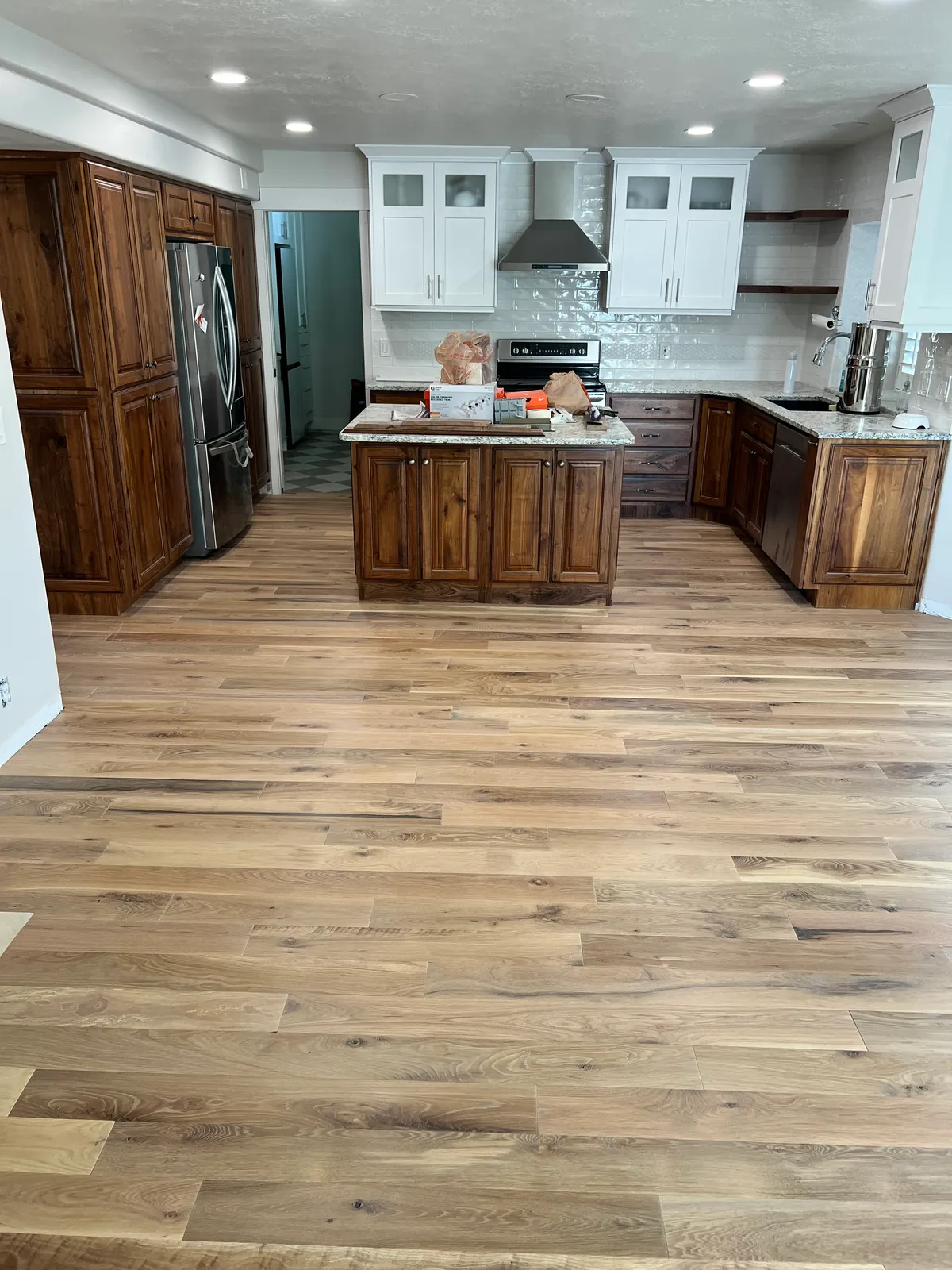 Hardwood floors in kitchen with island