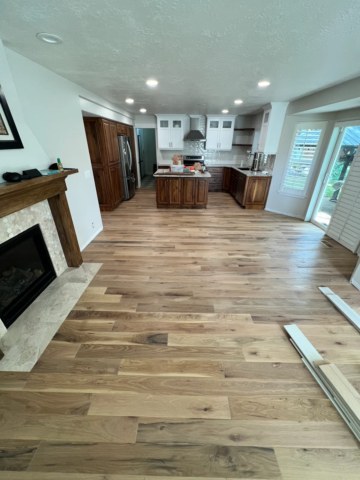 Kitchen with island and hardwood flooring